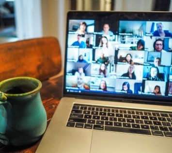 computer with zoom meeting on screen